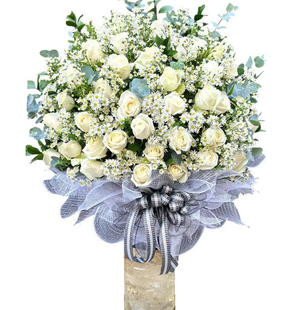 Vase Of Funeral White Roses