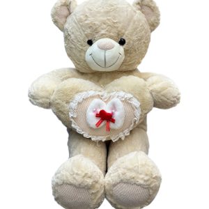 Brown teddy bear hugs heart